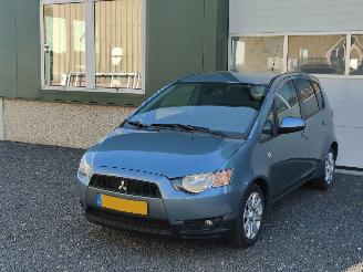 uszkodzony samochody osobowe Mitsubishi Colt 1.3 Edition Airco Cruise Tr.haak 2012/2