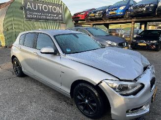 Schadeauto BMW 1-serie 114i EDE Buisness Sport 2013/4