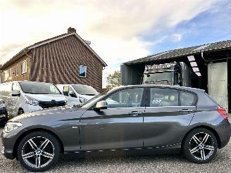Avarii autoturisme BMW 1-serie 118i 136pk 6-bak Cent Sportline 5drs - schuifdak - nap - leer - navi - stoelverw - licht + regensensor 2017/2